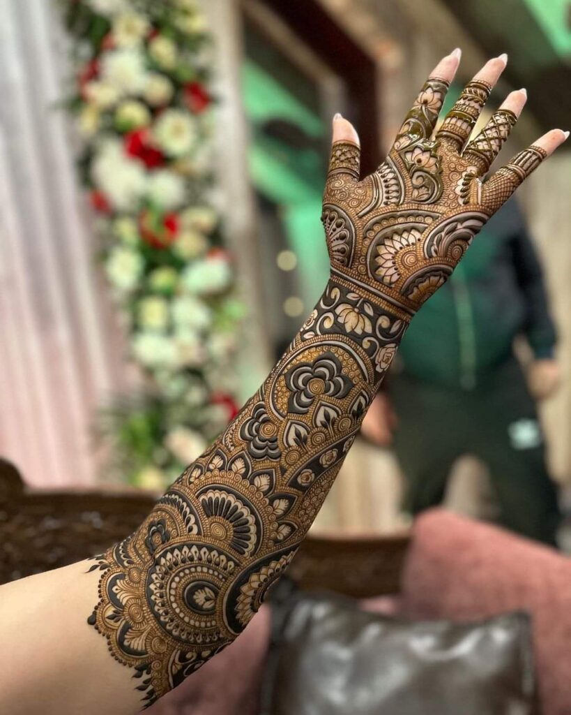 A Girls is Showing Their Hands Punjabi Mehndi Design by Henna House- Punjabi Mehndi Artist in Jaipur.