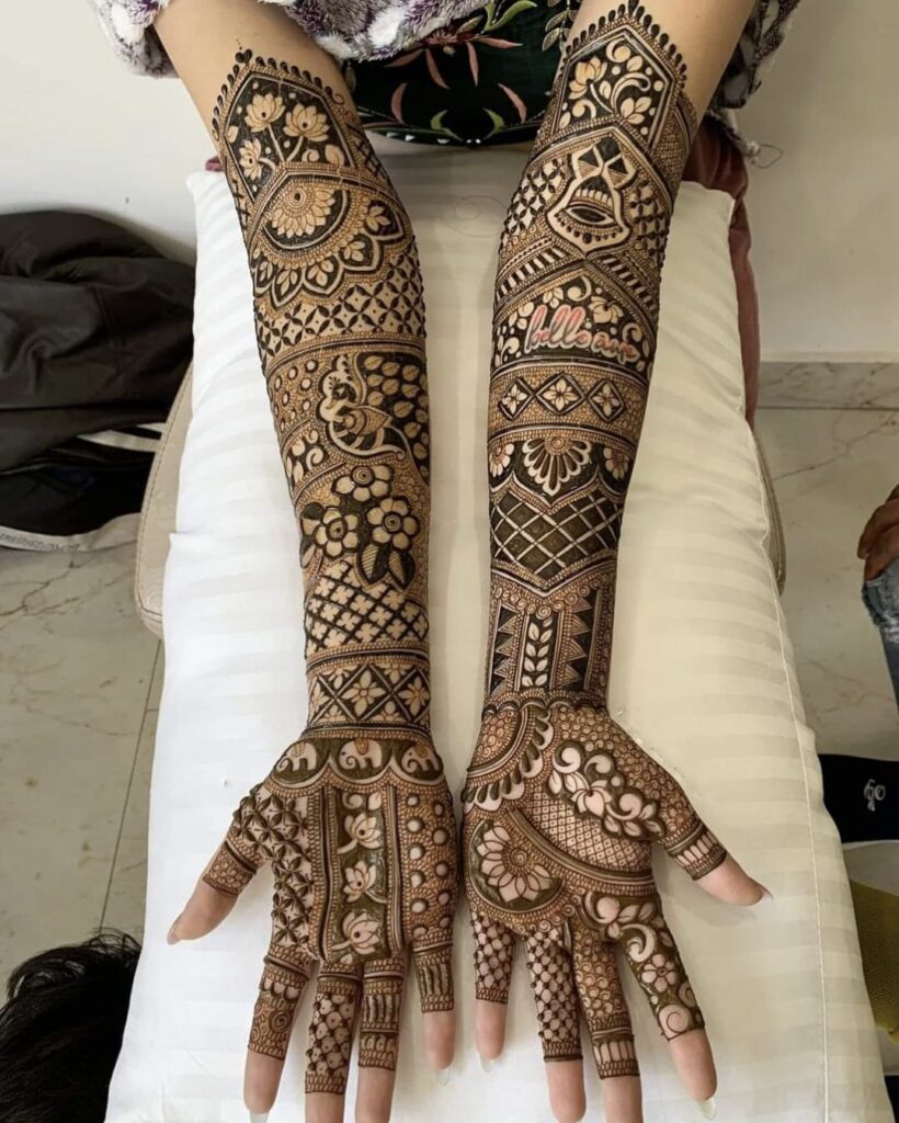 A Girls is Showing Their Hands Indian Mehndi Design by Henna House- Indian Mehndi Artist in Jaipur.