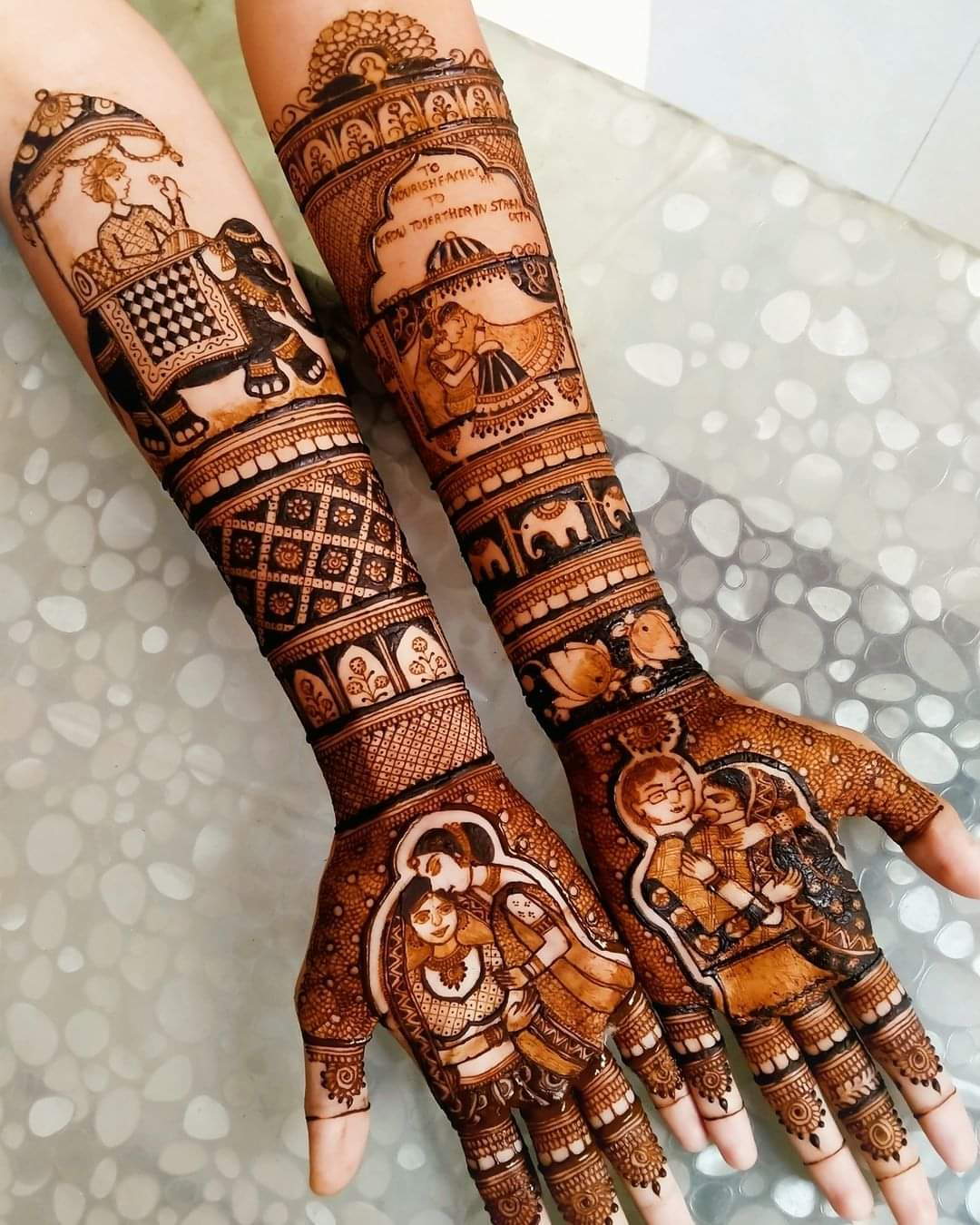 A Girls is Showing Their Hands Bridal Mehndi Design by Henna House- Bridal Mehndi Artist in Jaipur.